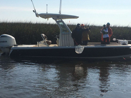 Captain on boat in the water charter fishing