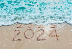 north-myrtle-beach-fishing-charters-2024 ocean and sand with Happy New Year 2024 from North Myrtle Beach Fishing Charters