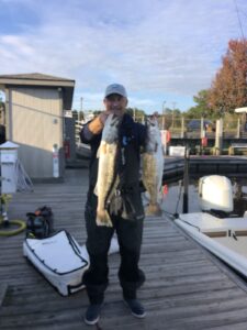 Myrtle-Beach-Inshore-Fishing-Guides-captain-keith-logan Top Myrtle Beach Inshore Fishing Guide Captain Keith Logan Holding Speckled Sea Trout on the dock.
