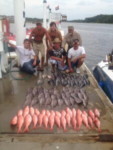 deeps-sea-fishing-murrells-inlet-south-carolina-sc Men on the dock with bottom fish on it from a deep sea fishing trip with North Myrtle Beach Fishing Charters
