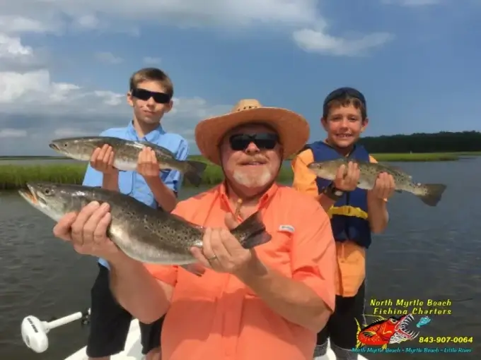 Family on a private inshore fishing charter in North Myrtle Beach, South Carolina