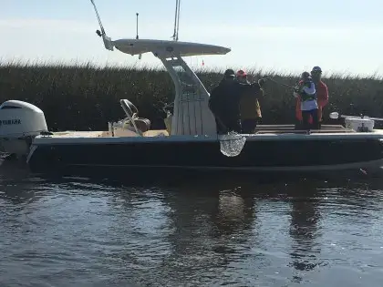 myrtle beach inshore fishing charter boat Inshore fishing charter boat preparing to fish calm coastal waters near Myrtle Beach